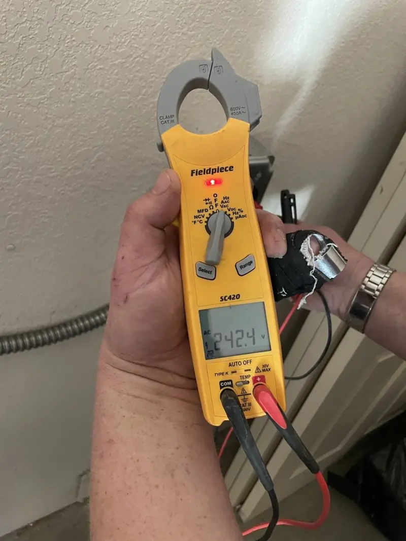 Voltage testing with clamp meter during Whole House Surge Protector in Estherville